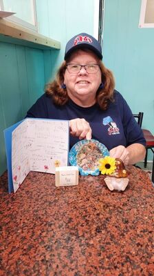 Mary with gifts from Community Living 2024
